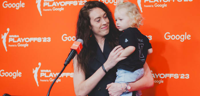 Breanna Stewart holds her first child Ruby after accepting the 2023 WNBA MVP Award